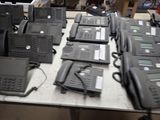 a lot of telephones that are on a table