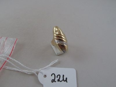 a tag with a gold leaf on it and a white tag with a red string
