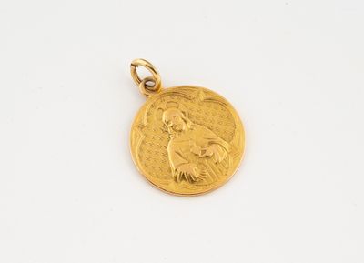 a gold coin with a woman ' s face on it