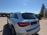 the rear end of a mercedes gle parked in a parking lot