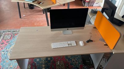 a desk with a computer and a keyboard on it
