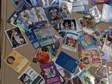 a cardboard box full of baseball cards on the floor