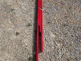 a red piece of equipment laying on the ground