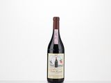 a bottle of red wine sitting on top of a table