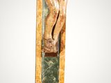 a statue of jesus on the cross on a pedestal