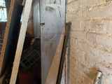 an image of a room with a door and a ladder
