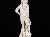 statue of a boy with a dog on a pedestal