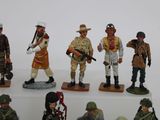 many figurines of soldiers on display on a shelf