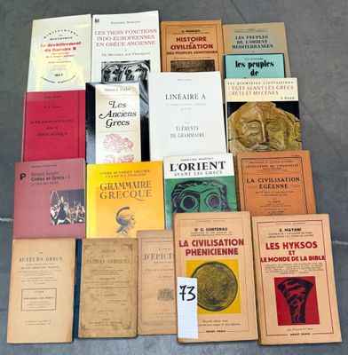 several books are stacked on top of each other on a table