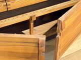 a wooden table with a drawer underneath it on a hard wood floor