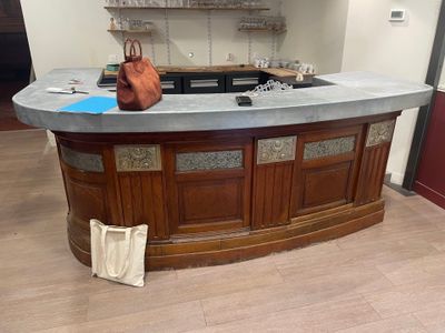 a counter with a purse sitting on top of it