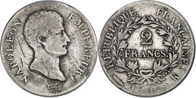 a close up of a coin on a white background