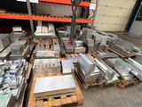 a large pile of metal items in a warehouse