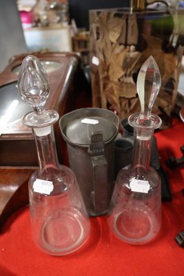 a red table with a bunch of glass items on it