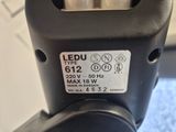 a close up of a parking meter on a table
