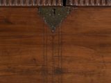 an antique wooden chest with ornate carvings and brass hardware