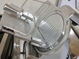 a large slicer that is sitting on top of a counter