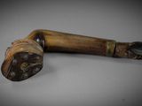 a close up of a wooden stick with a handle