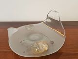 a clear glass bowl with a light bulb inside of it