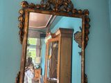 a mirror hanging on the wall in a room