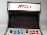 a small video game machine sitting on a table
