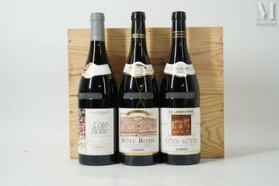 trois bouteilles de vin dans un coffret en bois