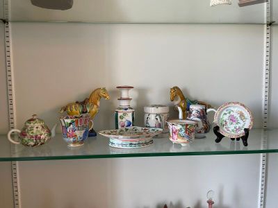 a glass shelf that has a lot of different items on it