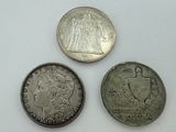 three different types of coins are shown on a white surface