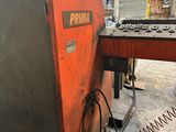 an orange machine is sitting inside of a building