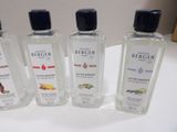 four different types of hand sanitizers are lined up on a counter