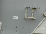 a close up of a metal door with a number on it