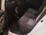 a white car with a black seat in the back of it