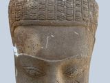statue of a man with a hat on top of it ' s head