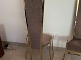 two chairs sitting next to each other in a room