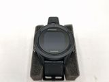 a close up of a smart watch on a stand on a white surface