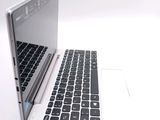 two laptops sitting side by side on a white surface