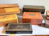many different types of wooden boxes on a table
