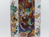 an image of a white vase with a colorful design on it