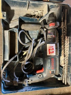 a box with tools in it sitting on the floor