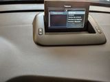 a tablet on the dashboard of a car in the car