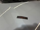 a sticker on the hood of a silver car