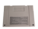 a nintendo game console sitting on top of a white table