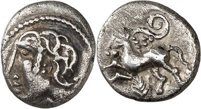 a silver coin with an image of a horse on it