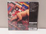 the cd cover of a baby laying on top of a blanket