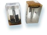 two boxes that have a coffee grinder inside of them