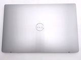 laptop with a dell logo on the back of it sitting on a white surface
