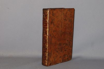 an old book that is sitting on a table