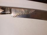 a knife that is sitting on top of a table