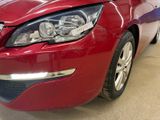 a red car that is parked in a garage