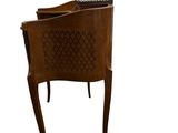 brown leather chair with a basket on the back of it